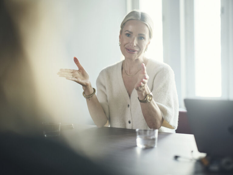 Woman speaking in meeting